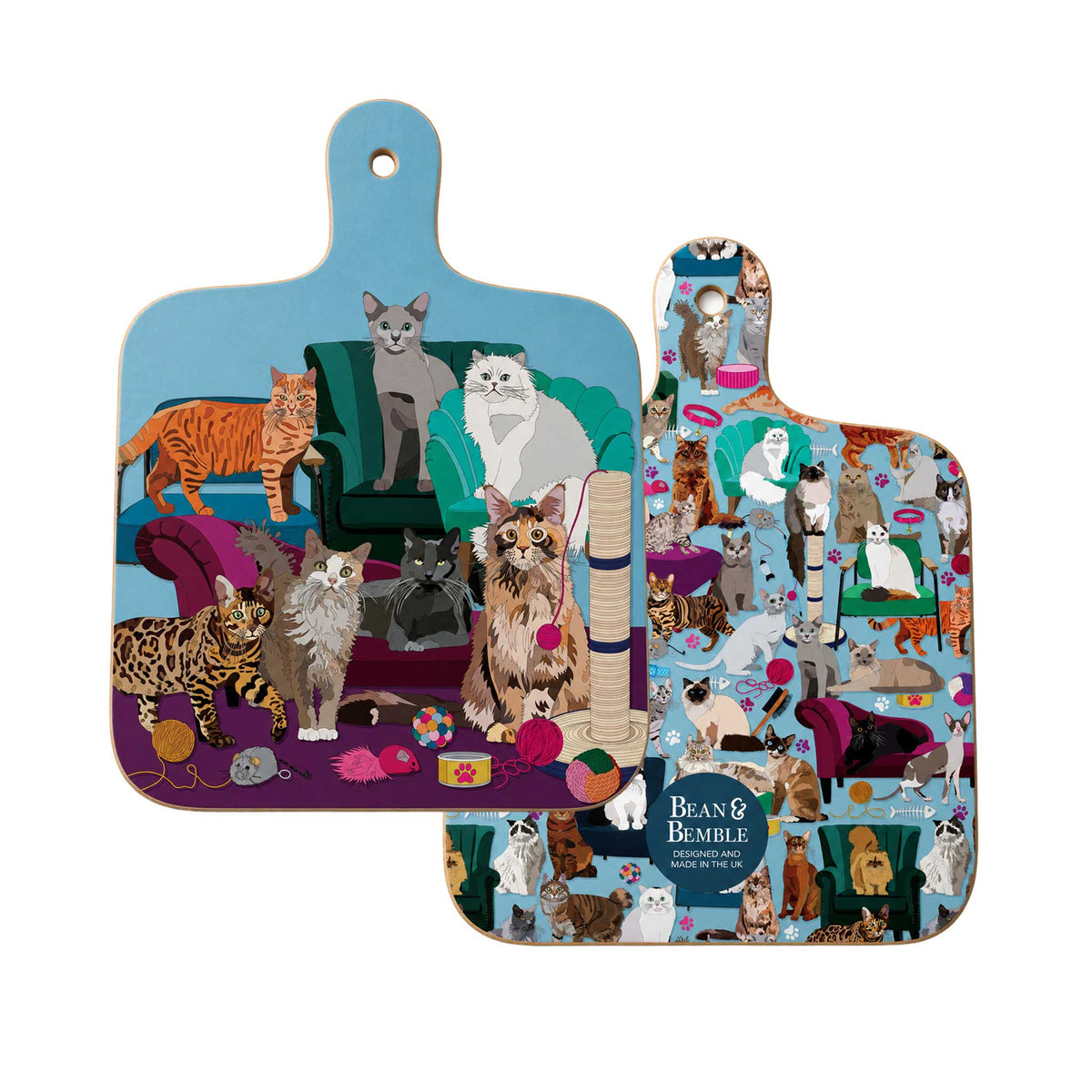 Front and back of Comfy Cats mini chopping board, showing colourful illustrated cats, sofas and cat toys on a blue background.