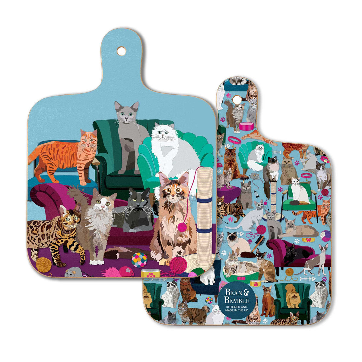 Front and back of Comfy Cats mini chopping board, showing colourful illustrated cats, sofas and cat toys on a blue background.