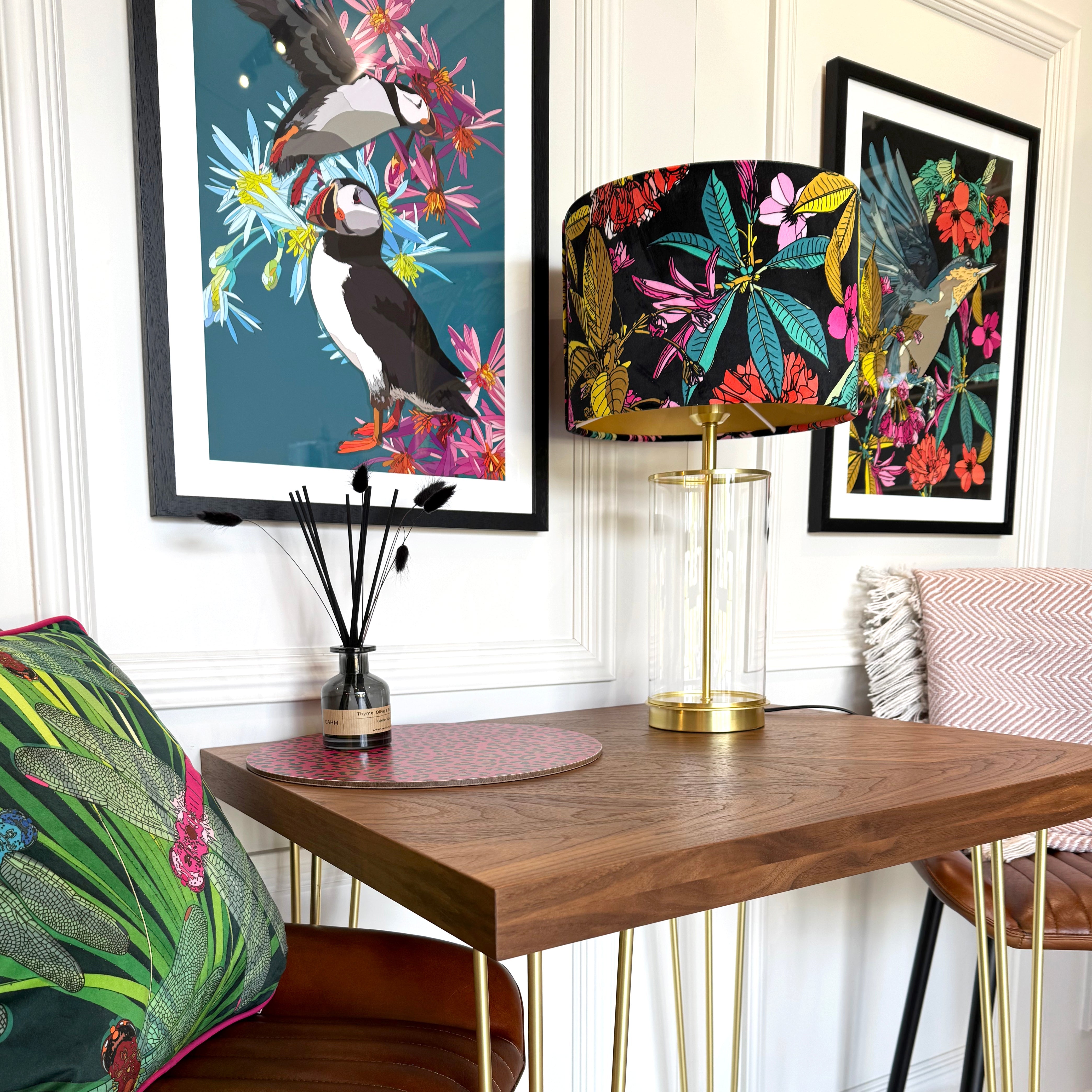 Bird wall art, puffins and a nuthatch with a colourful lampshade and bar srea