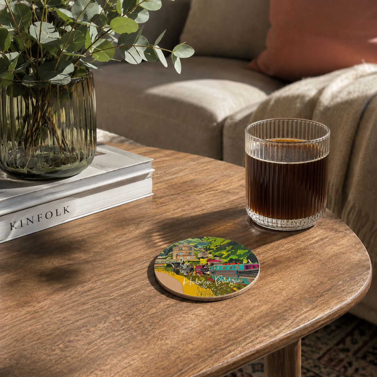Round melamine coaster with colorful Hebden Bridge street scene design