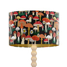 Black mushroom velvet drum lampshade for a table lamp or floor lamp base, featuring a woodland toadstool design and matte gold inner.