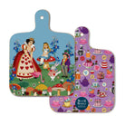 Double sided Mini melamine chopping board with illustrations of Alice in Wonderland, the queen of hearts, mad hatter, white rabbit and mushrooms.  Reverse is lilac with a cakes and puddings pattern.