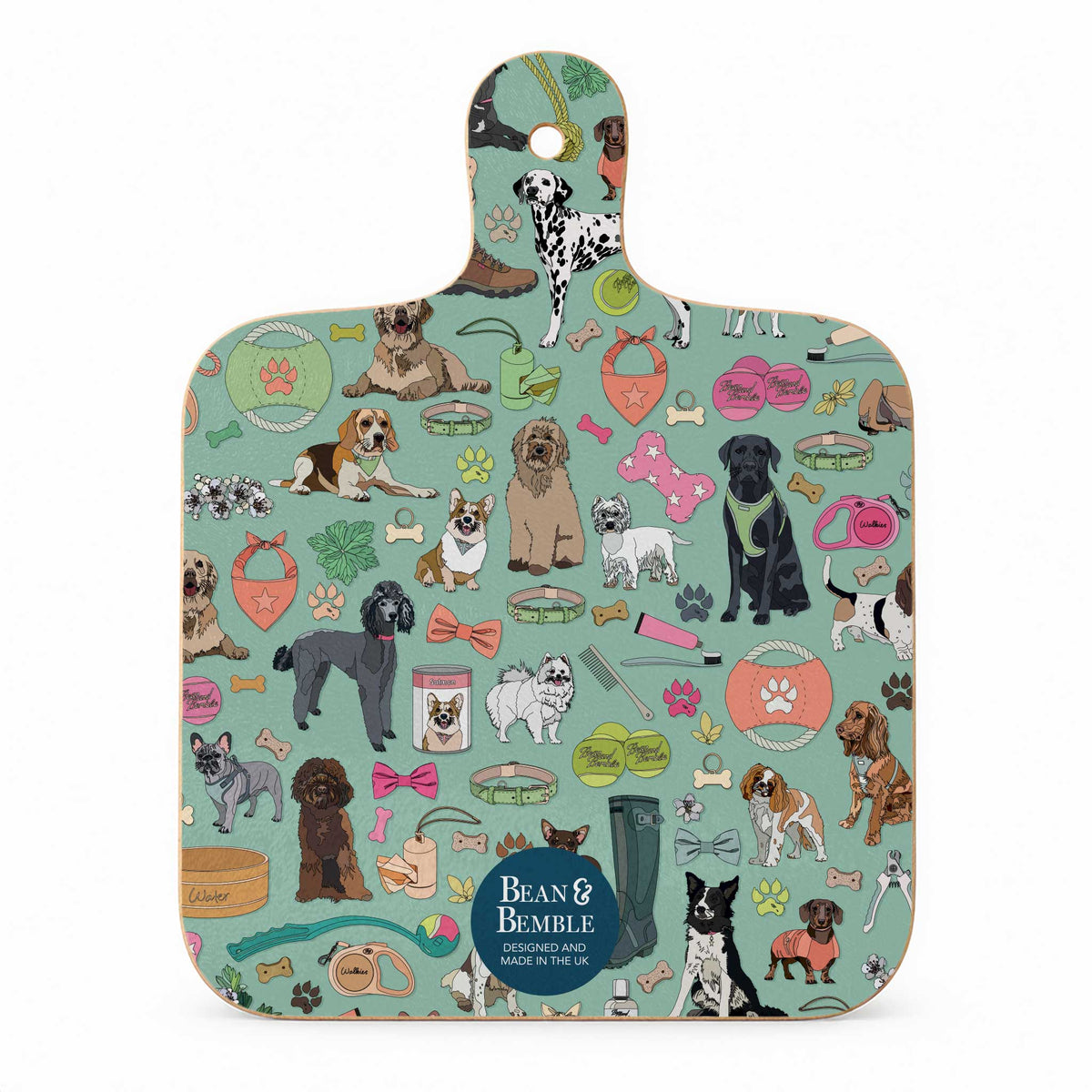 A rectangular wooden cutting board with a rounded handle, featuring a colorful cartoon dog pattern on a mint green background. The design includes various dog breeds, bowls, leashes, and bones.