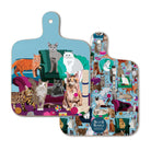 Front and back of Comfy Cats mini chopping board, showing colourful illustrated cats, sofas and cat toys on a blue background.