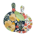 Large round floral chopping board with blue, green, cream, and orange artwork