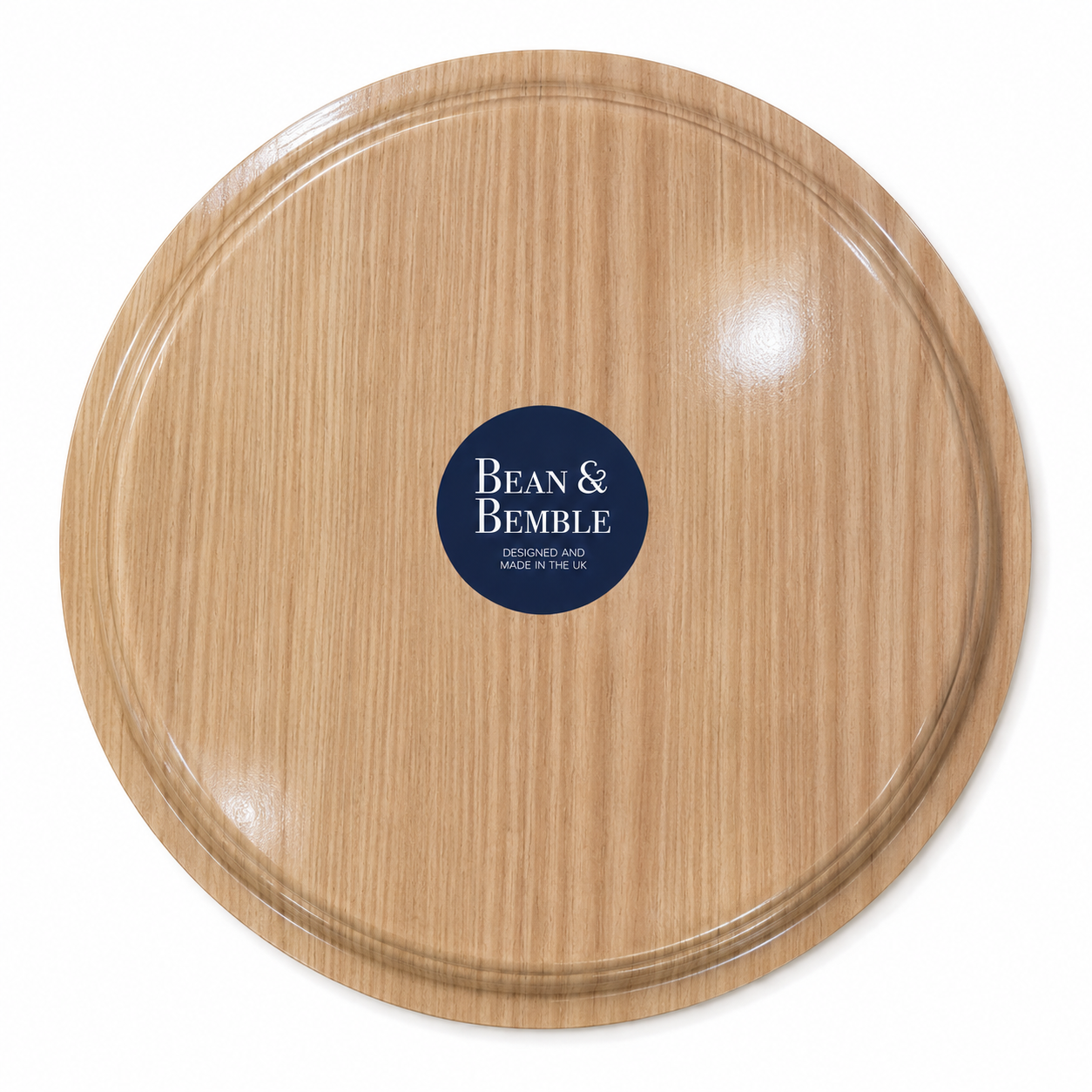 Back of 35cm round melamine serving tray with light woodgrain-effect finish and Bean & Bemble branding.