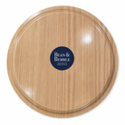 Back of 35cm round melamine serving tray with light woodgrain-effect finish and Bean & Bemble branding.