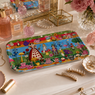Alice in Wonderland small melamine tray styled on a dressing table with perfume, jewellery and decorative accessories.